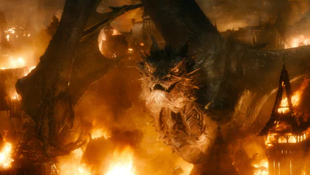 HD desktop wallpaper from The Hobbit: The Battle of the Five Armies featuring a dragon attacking a fiery village.