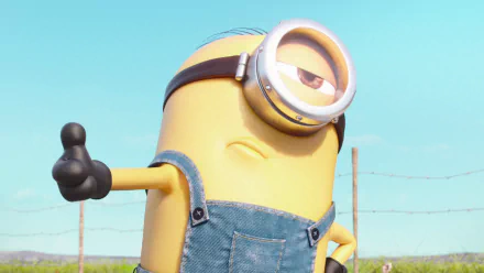 HD desktop wallpaper featuring Stuart the Minion from the movie Minions, confidently giving a thumbs up with a blue sky and fence in the background.