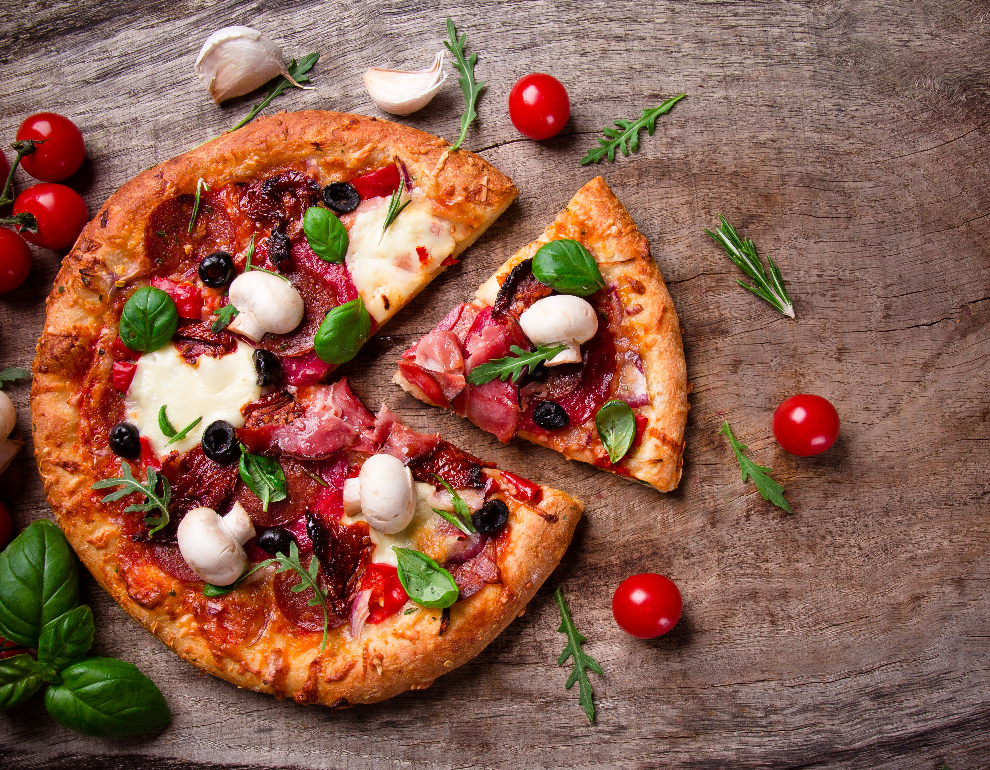 Italian Pizza with salami, mozzarella and olives for lunch or dinner