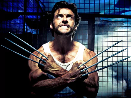 HD desktop wallpaper featuring Logan James Howlett from X-Men Origins: Wolverine in a fierce pose with his iconic claws extended. The intense backdrop reflects the movie's dramatic atmosphere.