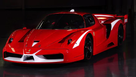 HD PC desktop wallpaper featuring a sleek red Ferrari Enzo sports car against a dark background.