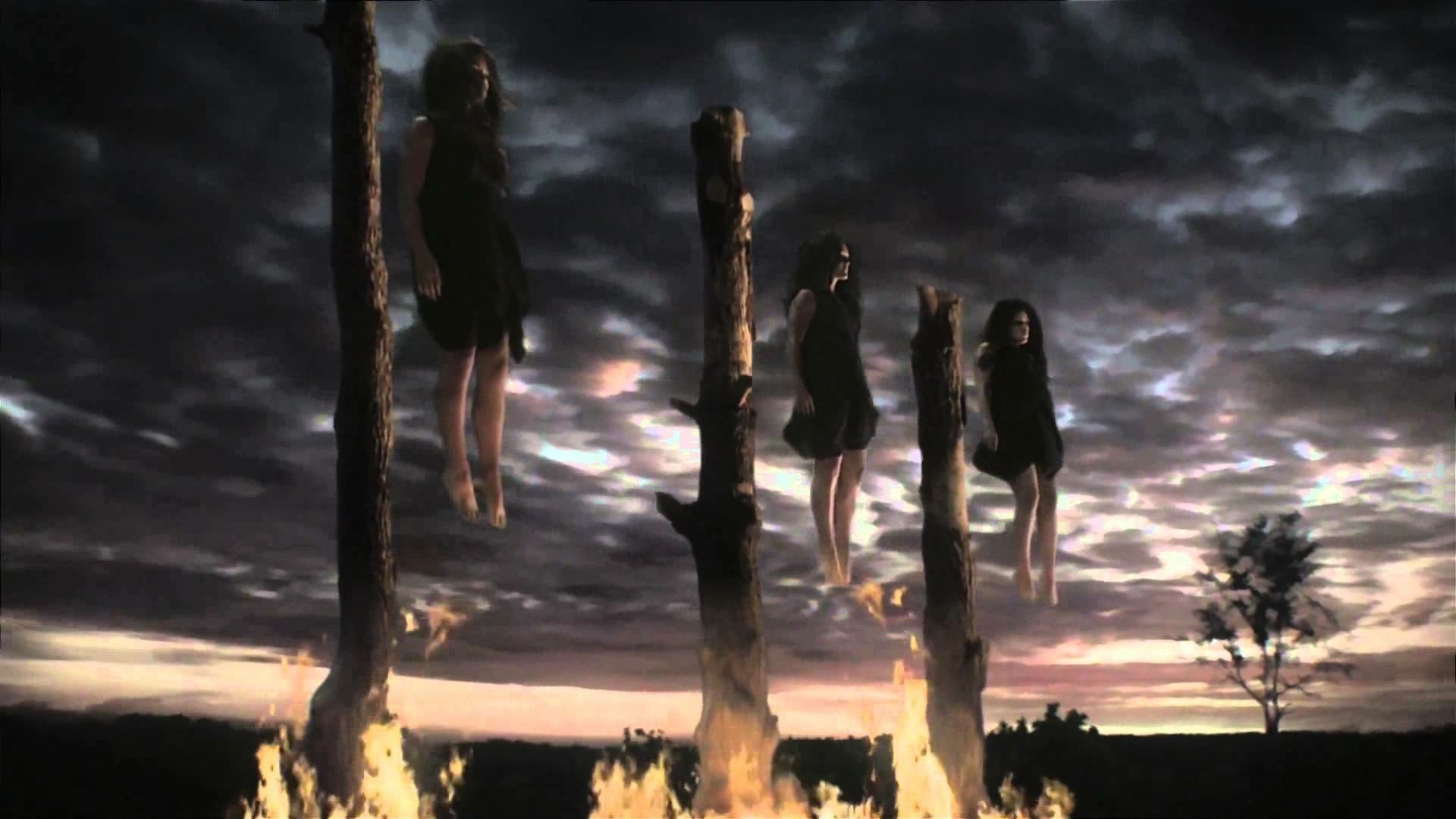 HD PC desktop wallpaper of American Horror Story featuring dark, eerie hanging figures against a stormy sky, capturing the show's haunting atmosphere.