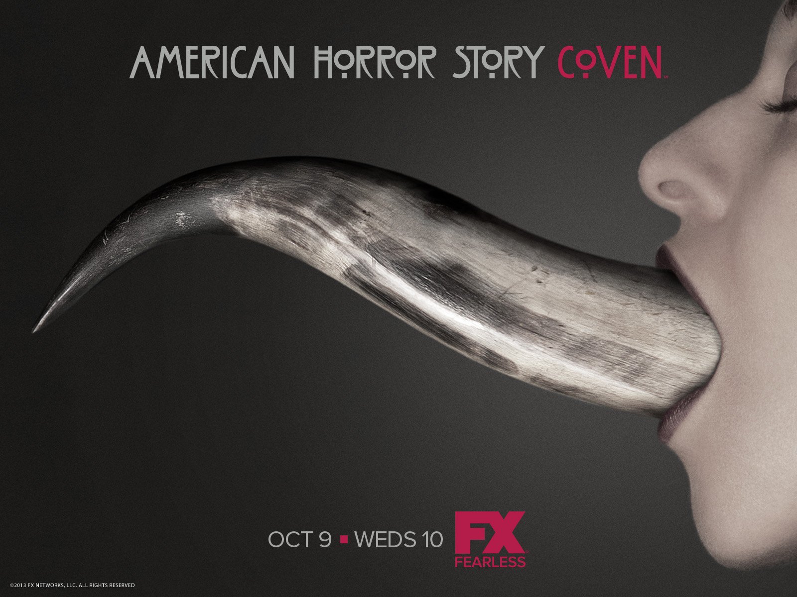 A striking HD wallpaper from American Horror Story: Coven, featuring a close-up of a mouth with an elongated, metallic tongue, emphasizing the show's dark themes.