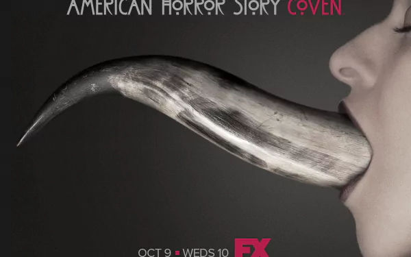 A striking HD wallpaper from American Horror Story: Coven, featuring a close-up of a mouth with an elongated, metallic tongue, emphasizing the show's dark themes.