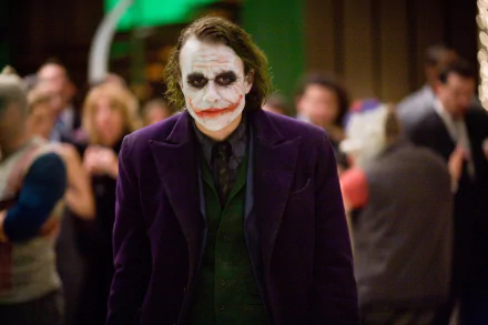 Heath Ledger as the Joker, a haunting scene from *The Dark Knight*, features his iconic makeup and purple suit against a bustling party backdrop, creating a striking HD wallpaper.