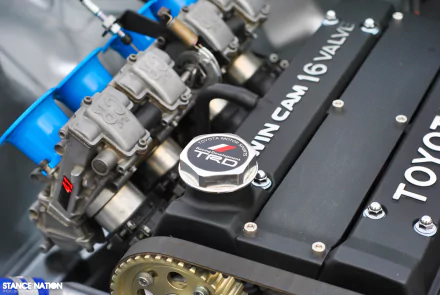 Close-up of a man-made Toyota engine with a 16-valve twin cam system, captured in high definition as a detailed PC desktop wallpaper background.