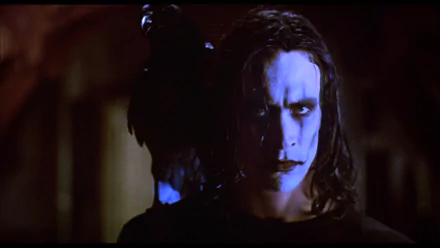 HD PC desktop wallpaper featuring Brandon Lee as the iconic character from the movie The Crow, with dramatic lighting highlighting his face and intense expression.