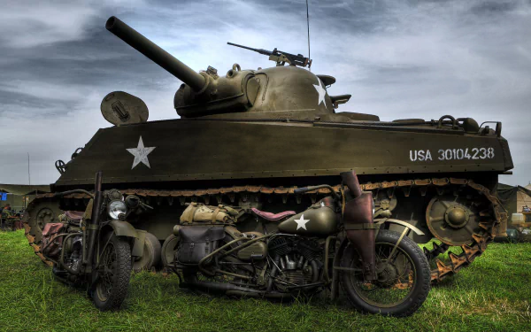 HD desktop wallpaper featuring a military M4 Sherman tank with an armed motorcycle parked beside it under a moody sky.
