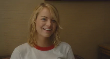 HD desktop wallpaper featuring Emma Stone smiling in a scene from the movie Aloha.