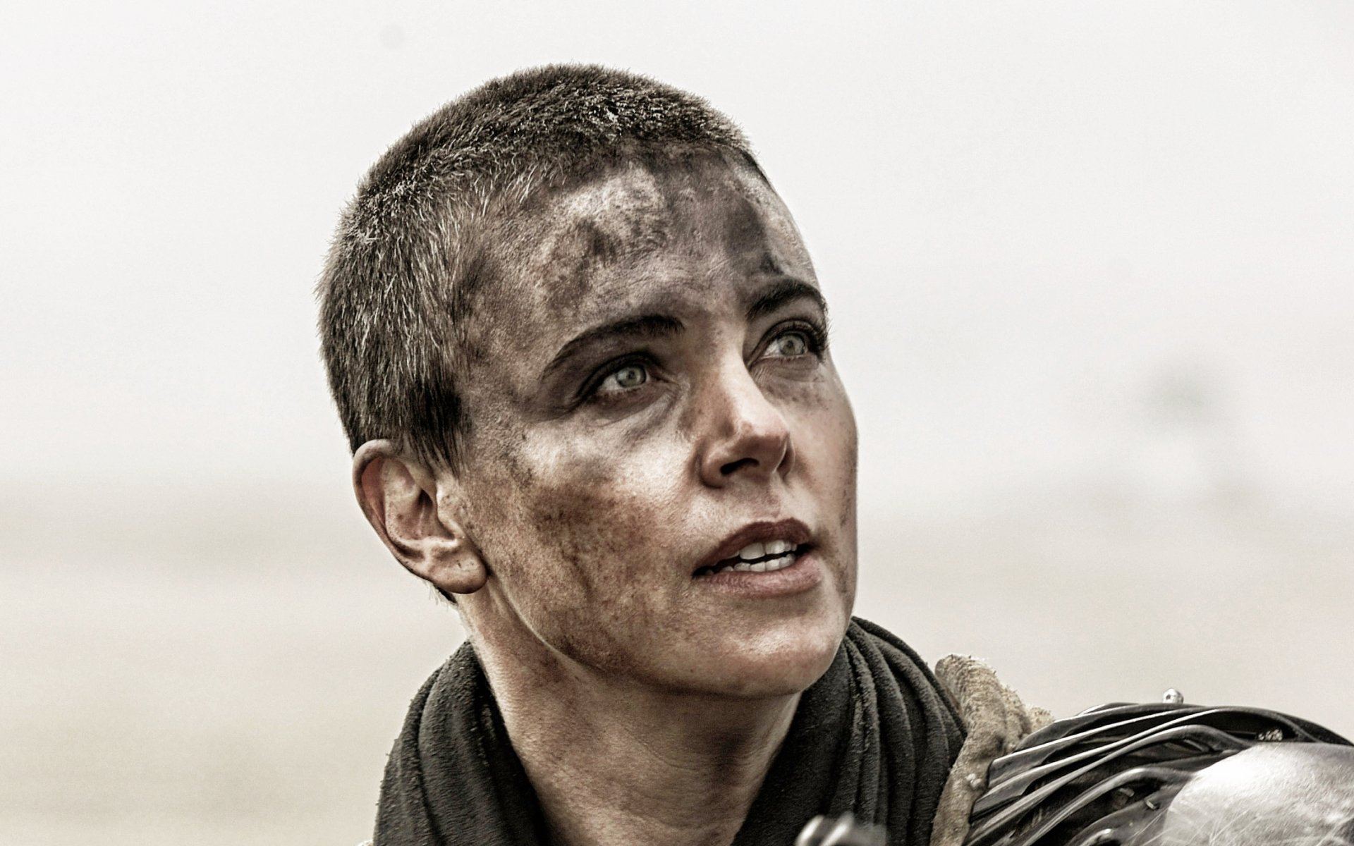 HD PC desktop wallpaper featuring Charlize Theron as Imperator Furiosa from the movie Mad Max: Fury Road, showcasing her intense and determined expression.