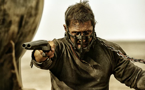 Max Rockatansky, portrayed by Tom Hardy, fiercely aims his weapon in a gritty scene from *Mad Max: Fury Road*, showcasing intense action in stunning 4K Ultra HD.