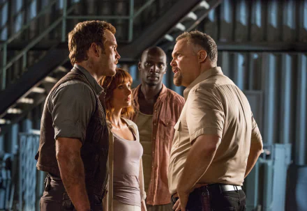 HD desktop wallpaper featuring Omar Sy, Bryce Dallas Howard, Chris Pratt, and Vincent D'Onofrio in a tense scene from the movie Jurassic World.