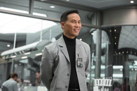 B.D. Wong smiles in a sleek lab setting from the movie Jurassic World, showcasing a modern and dynamic atmosphere in this 4K Ultra HD desktop wallpaper.