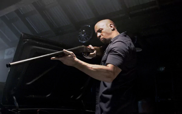 Vin Diesel as Dominic Toretto in a dramatic scene from Furious 7. The image is a high-definition desktop wallpaper, capturing intense action and atmosphere.