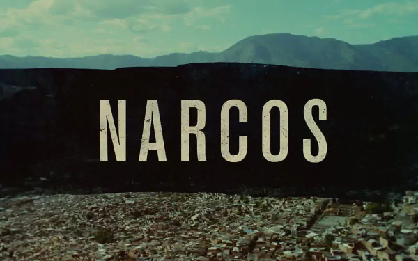 HD desktop wallpaper of 'Narcos' title with a sprawling cityscape and mountains in the background.