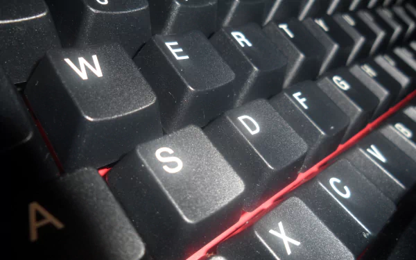 Close-up of a black keyboard showcasing the keys in detail, designed as a high-definition PC desktop wallpaper and background, highlighting technology and modern design.