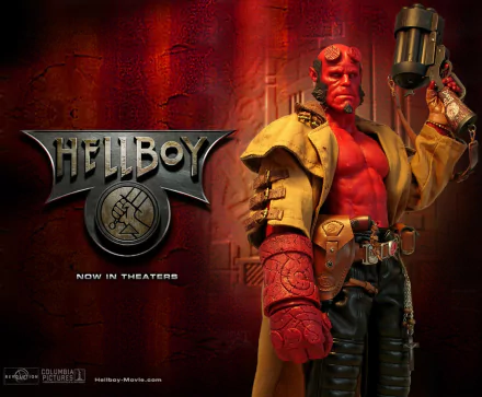 High-definition wallpaper featuring a detailed figurine of Hellboy from the 2004 movie, set against a bold, textured background with the film's logo.