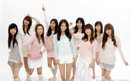 HD PC desktop wallpaper featuring the K-pop girl group Girls' Generation (SNSD) posing together in light-colored outfits, highlighting their music and vibrant style.