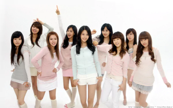 HD PC desktop wallpaper featuring the K-pop girl group Girls' Generation (SNSD) posing together in light-colored outfits, highlighting their music and vibrant style.