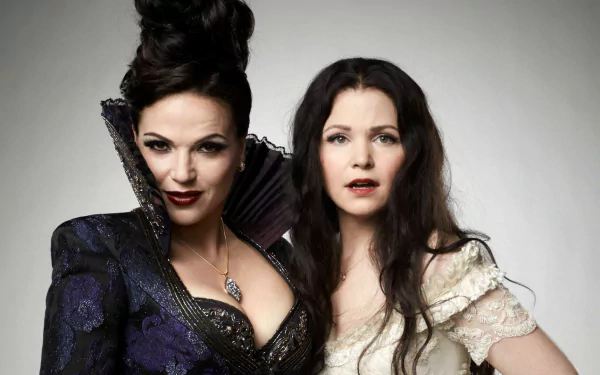 Snow White and the Evil Queen from Once Upon A Time pose dramatically, showcasing their contrasting characters in this HD desktop wallpaper featuring Lana Parrilla.