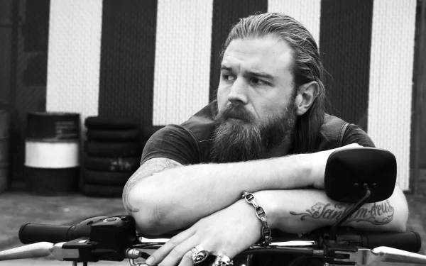 HD desktop wallpaper featuring Ryan Hurst as his character from the TV show Sons of Anarchy, resting on a motorcycle.
