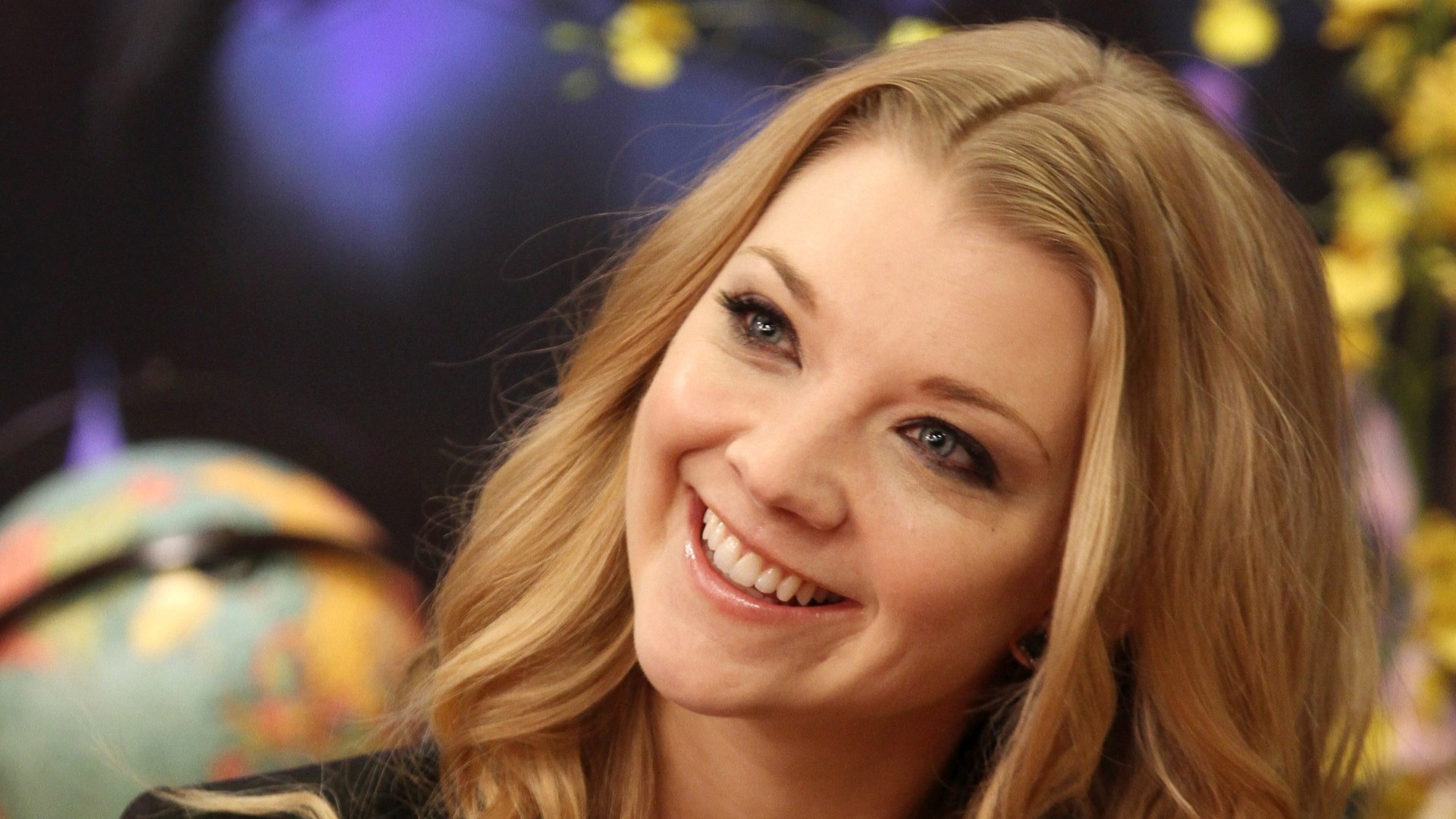 HD PC desktop wallpaper featuring a close-up of celebrity Natalie Dormer smiling against a softly blurred background.