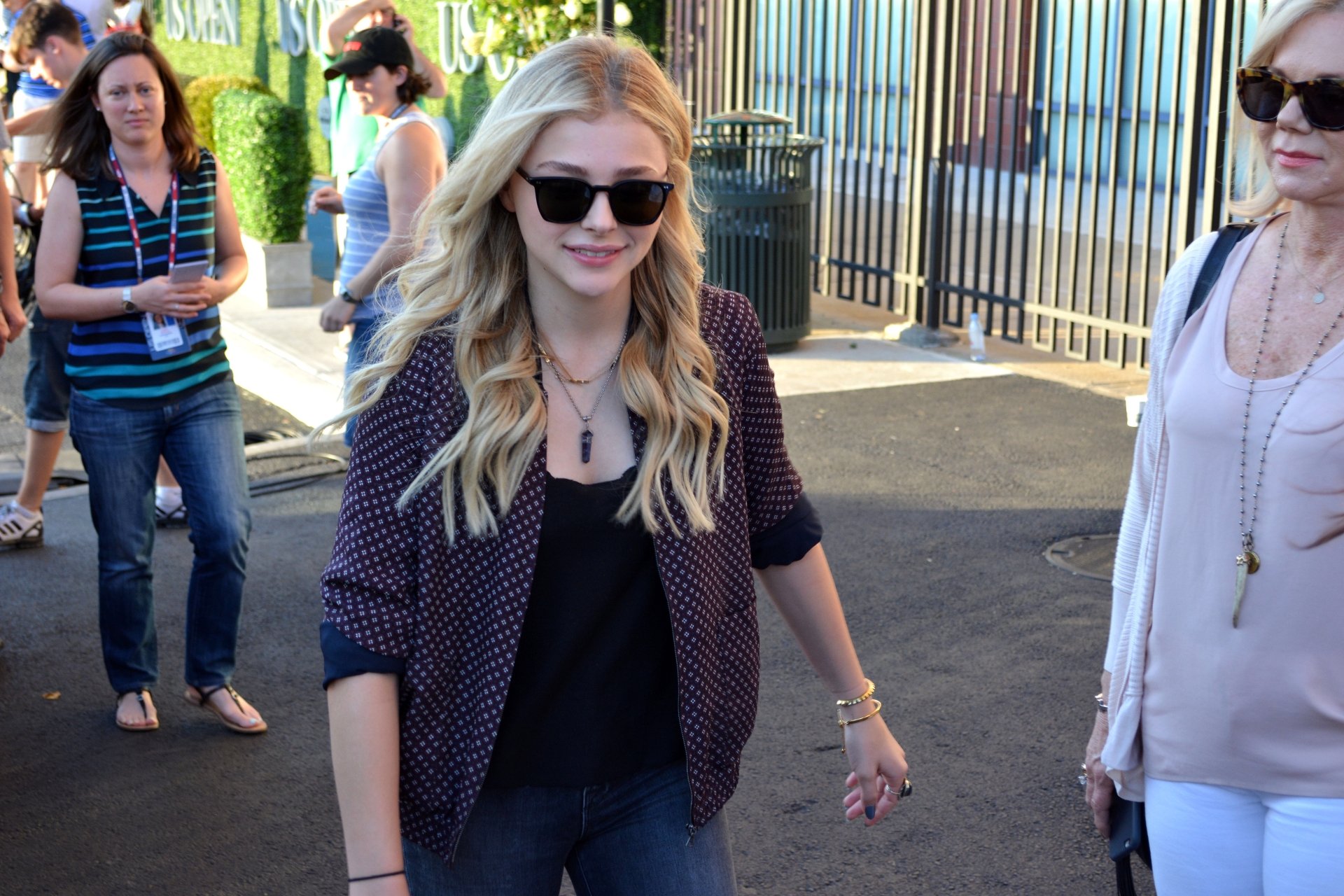 Chloë Grace Moretz walking outdoors in casual attire with sunglasses, captured in a high-resolution 4K Ultra HD PC desktop wallpaper image.