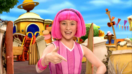 HD PC desktop wallpaper of LazyTown's pink‑haired character smiling and pointing on a bright, colorful outdoor set.