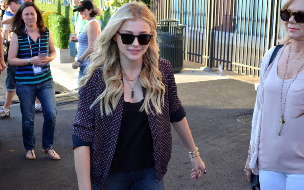 Chloë Grace Moretz walking outdoors in casual attire with sunglasses, captured in a high-resolution 4K Ultra HD PC desktop wallpaper image.