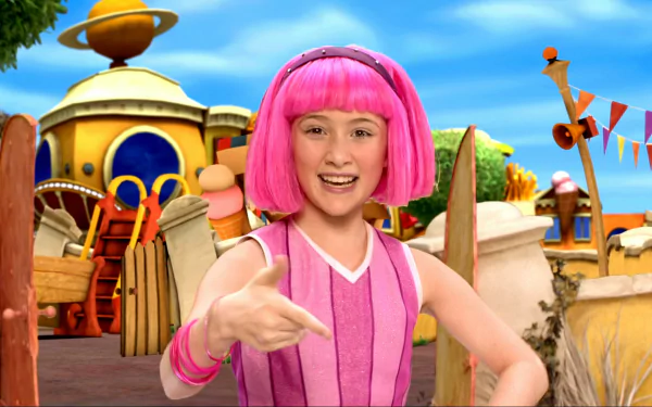HD PC desktop wallpaper of LazyTown's pink‑haired character smiling and pointing on a bright, colorful outdoor set.
