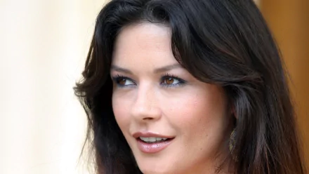 HD PC desktop wallpaper featuring a close-up of celebrity Catherine Zeta-Jones with natural makeup and soft waves in her dark hair.