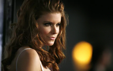 HD PC desktop wallpaper featuring a close-up portrait of celebrity Kate Mara with soft lighting and a blurred background.