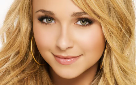 Close-up of Hayden Panettiere, featuring her radiant smile and golden hair, designed as a stunning HD desktop wallpaper and background.