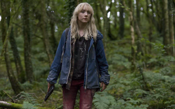 4K Ultra HD PC wallpaper: a young blonde woman in a blue jacket and bloodstained jeans holding a gun, standing in a dense green forest — cinematic movie still.