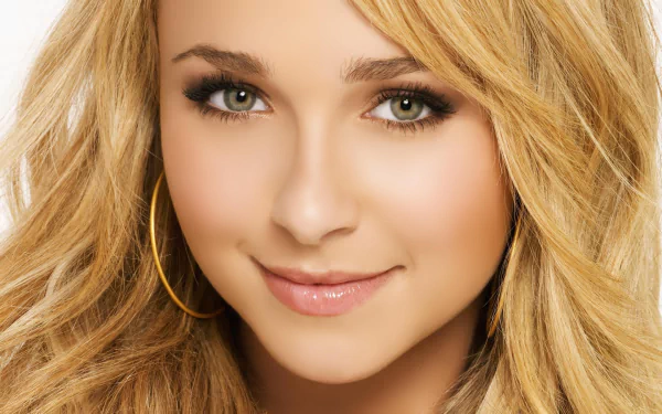 Close-up of Hayden Panettiere, featuring her radiant smile and golden hair, designed as a stunning HD desktop wallpaper and background.