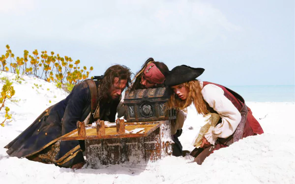James Norrington, Jack Sparrow, and Elizabeth Swann inspect a treasure chest on a beach in this HD wallpaper from *Pirates of the Caribbean: Dead Man's Chest*.