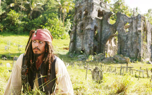 Jack Sparrow, portrayed by Johnny Depp, gazes thoughtfully amidst lush greenery and ancient ruins in this vivid wallpaper from *Pirates of the Caribbean: Dead Man's Chest*.