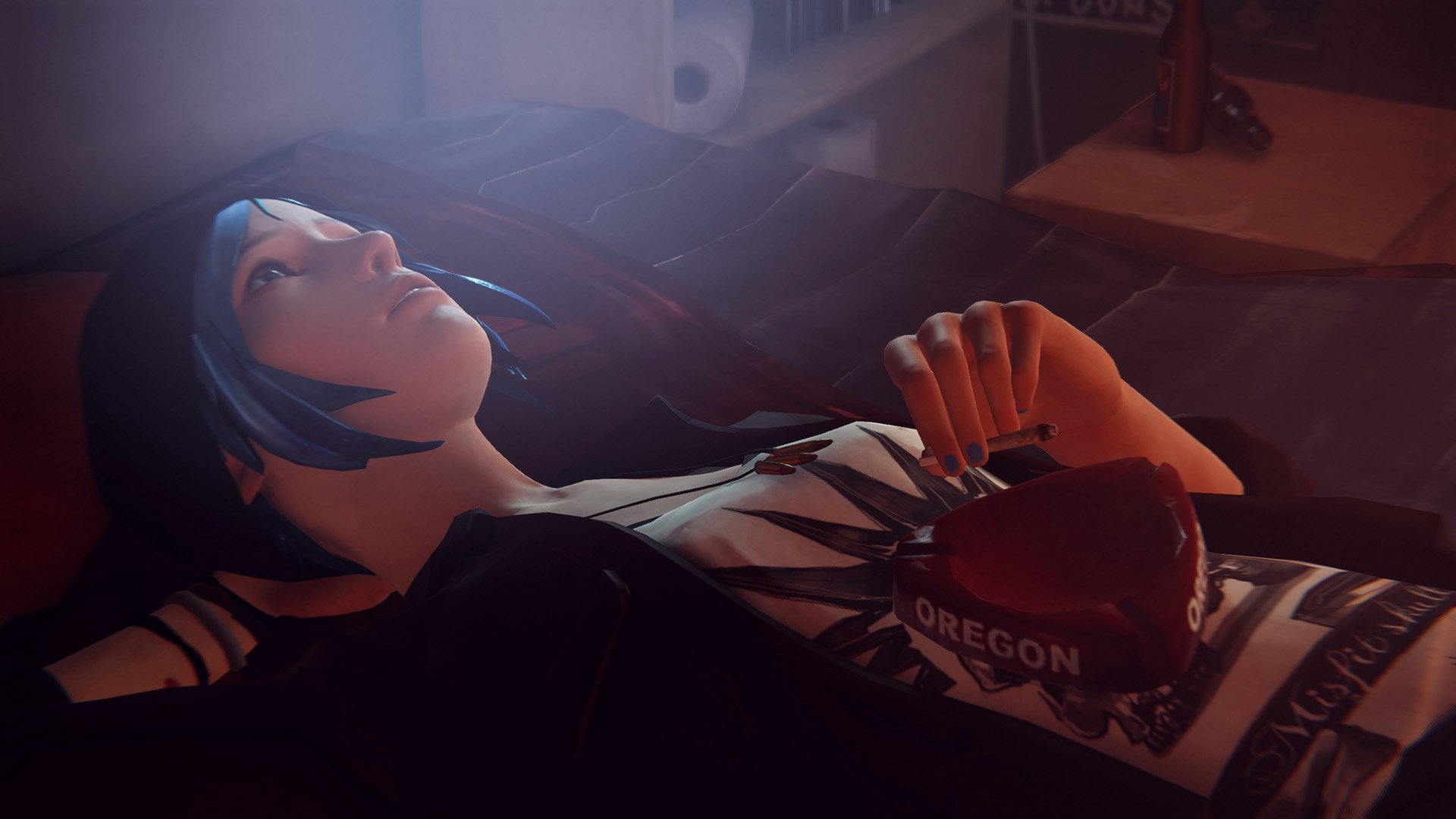 HD PC desktop wallpaper featuring Chloe Price from the video game Life Is Strange, lying down and holding a red Oregon beanie in a softly lit room.
