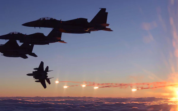 Four McDonnell Douglas F-15 Eagle fighter jets fly in formation above clouds at sunset in this 4K Ultra HD military desktop wallpaper and background.