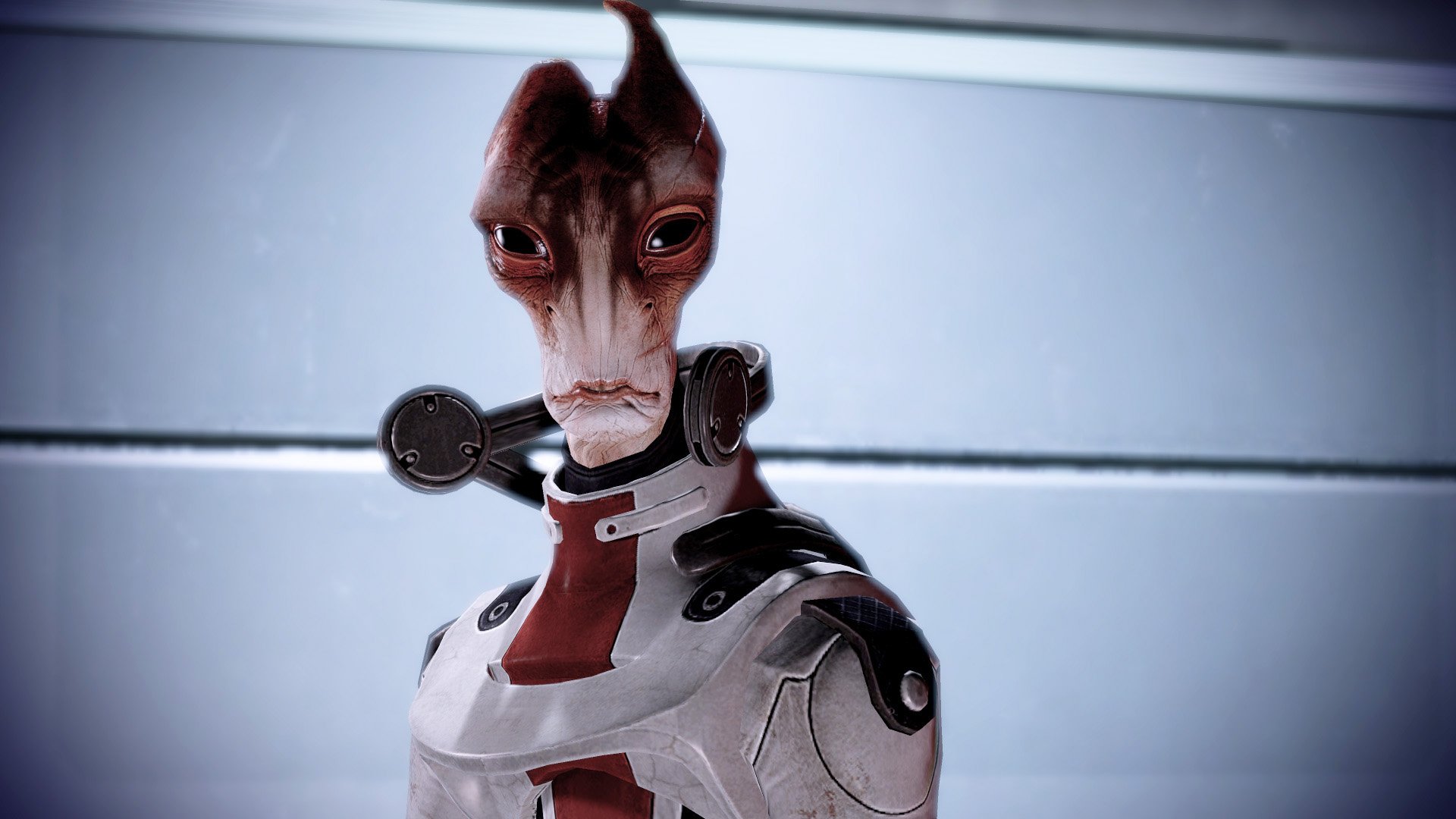 HD desktop wallpaper featuring Mordin Solus from Mass Effect 2, a character posed against a blurred background.