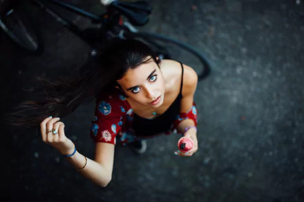 Close-up of a brunette woman with striking blue eyes, captured in stunning 8K Ultra HD detail, creating an immersive and vivid PC desktop wallpaper background.
