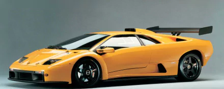 HD PC desktop wallpaper featuring a sleek yellow Lamborghini Diablo sports car against a neutral background.