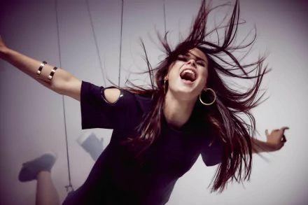 A dynamic HD wallpaper featuring Lena Meyer-Landrut, passionately singing with her hair flowing, embodying the energy of music and performance.
