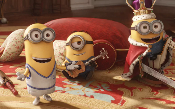 HD wallpaper featuring Minions characters Kevin, Stuart, and Bob from the movie Minions. Kevin wears a sports outfit, Stuart plays a guitar, and Bob is dressed as a king on a patterned carpet.