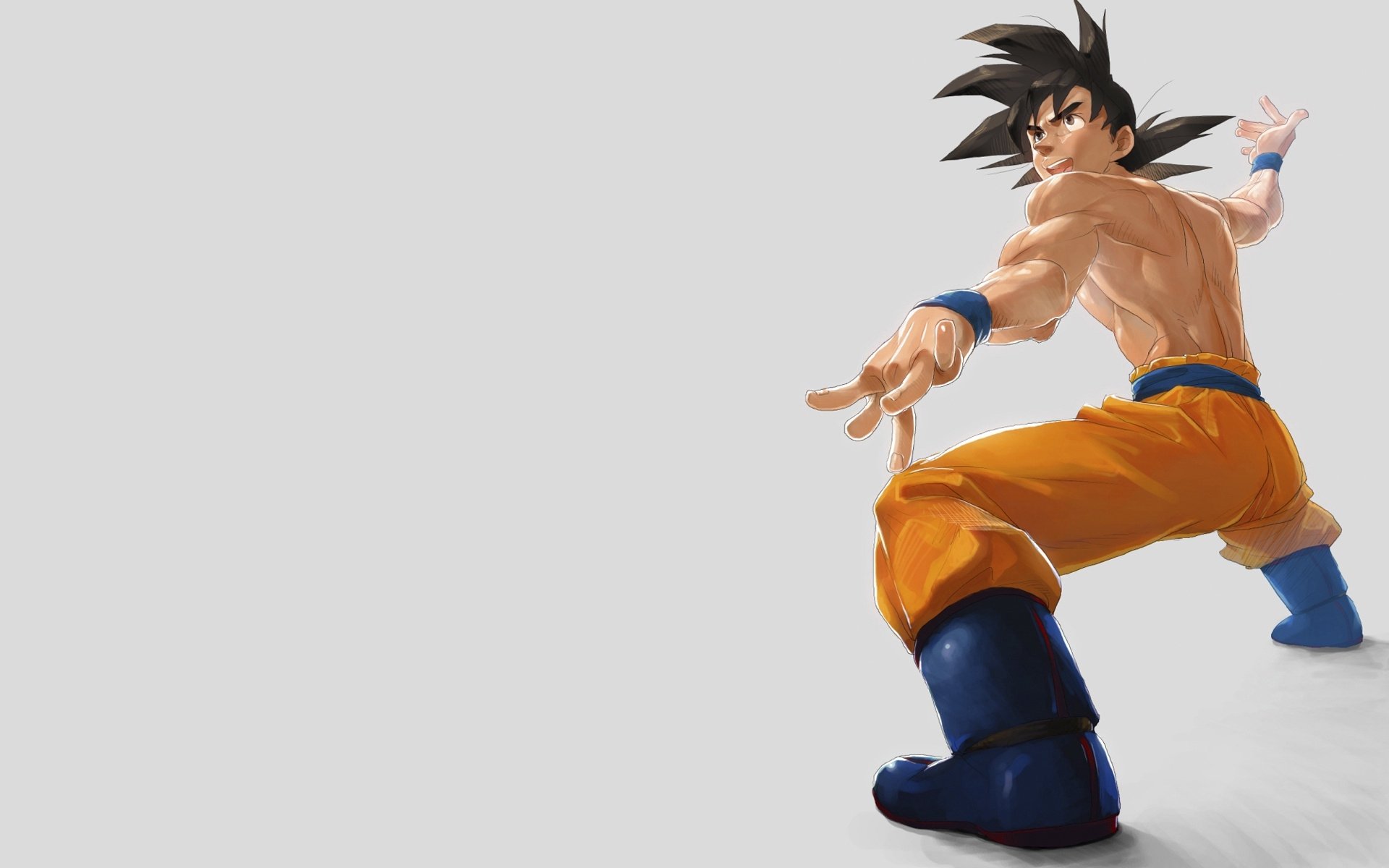 A dynamic HD wallpaper featuring Goku from Dragon Ball Z, showcasing his iconic look with spiky hair and martial arts stance against a simple background.