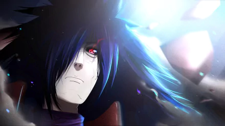 HD wallpaper featuring Madara Uchiha from Naruto, showcasing his Rinnegan and Sharingan eyes, with Akatsuki elements in the background. The image captures the intense and menacing aura of the character.