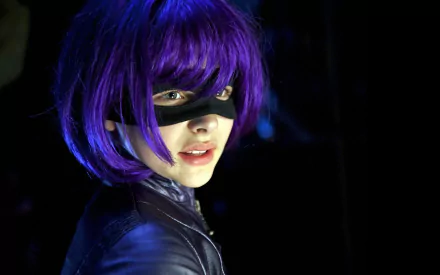 Hit-Girl, portrayed by Chloë Grace Moretz in the movie Kick-Ass, showcases her signature purple wig and mask in this striking HD desktop wallpaper.