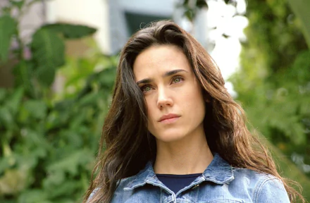 A striking HD wallpaper featuring Jennifer Connelly, showcasing her contemplative expression amidst a lush background, tied to her role in the movie Hulk.