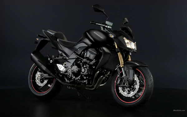 HD desktop wallpaper featuring a sleek black Kawasaki Z750 motorcycle against a dark background.
