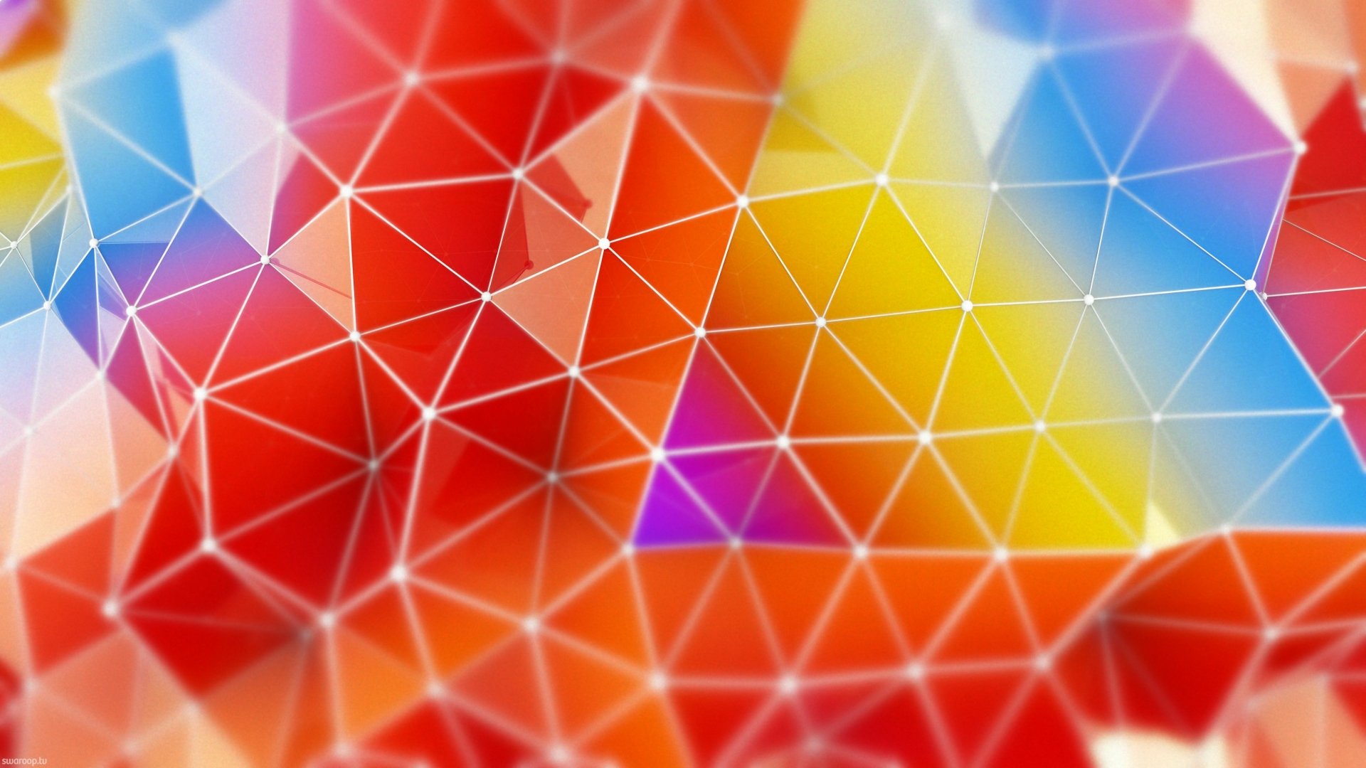 Abstract, artistic HD PC desktop wallpaper featuring a vibrant, colorful geometric pattern with interconnected triangular shapes blending red, yellow, blue, and purple hues.